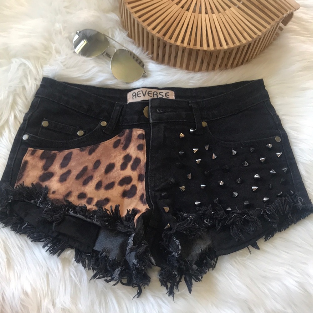 Reverse black denim leopard stud destroyed shorts